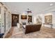 Comfortable living room featuring a fireplace, custom built-in shelving, and refined decor at 8724 Highgrove St, Charlotte, NC 28277