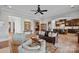 Open-concept living area showcasing a seamless flow into a kitchen and comfortable furnishings, ideal for relaxation at 8724 Highgrove St, Charlotte, NC 28277