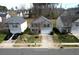 Suburban two-story home featuring a well-manicured lawn and a convenient two-car garage at 10114 Turkey Point Dr, Charlotte, NC 28214