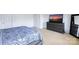 Calm bedroom boasts modern furnishings and neutral-toned walls and carpet at 10114 Turkey Point Dr, Charlotte, NC 28214
