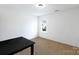 Bright bedroom with a large window offering natural light and fresh air at 10114 Turkey Point Dr, Charlotte, NC 28214