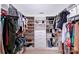 Spacious walk-in closet with custom shelving and ample storage for shoes, clothes, and accessories at 10114 Turkey Point Dr, Charlotte, NC 28214