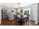 Eat-in kitchen featuring stainless steel appliances, granite countertops, and a breakfast bar at 10114 Turkey Point Dr, Charlotte, NC 28214