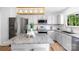 Bright kitchen with stainless steel appliances, granite countertops, and a large kitchen island at 10114 Turkey Point Dr, Charlotte, NC 28214
