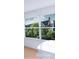 Inviting window view showcasing a lush backyard garden and mature trees at 10114 Turkey Point Dr, Charlotte, NC 28214