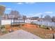 A trampoline and partial fencing accent the backyard at 105 Abel Peterson Dr, Mount Holly, NC 28120