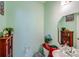 Charming half-bathroom with painted walls, a unique sink, a cabinet, and tasteful decor at 105 Abel Peterson Dr, Mount Holly, NC 28120