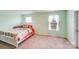 Bright and airy bedroom featuring neutral carpet, a comfy bed, and natural light at 105 Abel Peterson Dr, Mount Holly, NC 28120