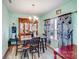 Charming dining room boasts stylish chandelier, dining table set, and decorative display cabinet at 105 Abel Peterson Dr, Mount Holly, NC 28120
