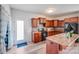 Well-equipped kitchen with wood cabinetry, modern appliances, and convenient access to the outdoors at 105 Abel Peterson Dr, Mount Holly, NC 28120