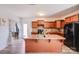 Open-concept kitchen with a center island and black appliances, and hard-surface countertops at 105 Abel Peterson Dr, Mount Holly, NC 28120