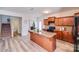 Modern kitchen featuring an island with sink, black appliances, and hard-surface countertops at 105 Abel Peterson Dr, Mount Holly, NC 28120