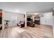 Open-concept living room features hardwood floors, cozy leather seating, and stylish decor at 105 Abel Peterson Dr, Mount Holly, NC 28120