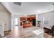 Spacious living area connects the kitchen, showcasing wood floors and natural light at 105 Abel Peterson Dr, Mount Holly, NC 28120