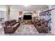 Inviting living room with leather sofas, entertainment center, and patterned area rug at 105 Abel Peterson Dr, Mount Holly, NC 28120