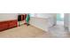 Upstairs landing featuring carpet, a wooden dresser, and some hanging clothes at 105 Abel Peterson Dr, Mount Holly, NC 28120