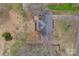 Bird's-eye view of a home with a deck and outdoor seating in a well-landscaped backyard at 107 Pinelake Dr, Kings Mountain, NC 28086