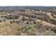 Wide aerial view showing a home nestled in a neighborhood, surrounded by trees at 107 Pinelake Dr, Kings Mountain, NC 28086