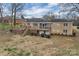 Expansive back yard with deck and covered patio, ideal for outdoor entertaining at 107 Pinelake Dr, Kings Mountain, NC 28086