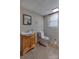 Functional basement bathroom features a toilet, sink with vanity, mirror, and a window at 107 Pinelake Dr, Kings Mountain, NC 28086