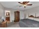Bedroom featuring a wooden armoire and adjacent access to the ensuite bathroom at 107 Pinelake Dr, Kings Mountain, NC 28086