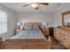 Bedroom featuring a comfortable bed with end tables and a dresser at 107 Pinelake Dr, Kings Mountain, NC 28086