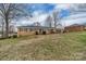 Traditional brick home featuring a well-manicured front yard and an attached garage at 107 Pinelake Dr, Kings Mountain, NC 28086