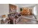 Inviting living room and dining area, showcasing elegant decor and beautiful hardwood floors at 107 Pinelake Dr, Kings Mountain, NC 28086