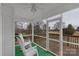 Screened in porch with rocking chairs and a serene view of the backyard at 107 Pinelake Dr, Kings Mountain, NC 28086