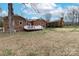 A lovely backyard featuring a deck attached to a red brick home at 10843 Caroline Acres Rd, Fort Mill, SC 29707