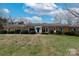Charming brick home with a well-manicured lawn and eye-catching blue door at 10843 Caroline Acres Rd, Fort Mill, SC 29707