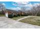 Brick home exterior featuring well-maintained landscaping and a two-car garage at 10843 Caroline Acres Rd, Fort Mill, SC 29707