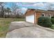 A two-car garage with a white door adjoins the brick home's driveway at 10843 Caroline Acres Rd, Fort Mill, SC 29707
