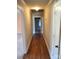Hallway features hardwood floors with views into the other rooms of the home at 10843 Caroline Acres Rd, Fort Mill, SC 29707