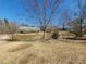A peaceful view of a pond reflecting the sky on a sunny day at 10843 Caroline Acres Rd, Fort Mill, SC 29707