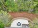 Aerial view of the backyard patio featuring a seating area and surrounding landscaping at 1122 Hartmann Ct, Fort Mill, SC 29715