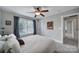 Cozy bedroom with neutral walls, ceiling fan, and natural light from a large window at 1122 Hartmann Ct, Fort Mill, SC 29715