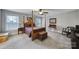 Bedroom features a four-poster bed, accent furniture, and great natural light at 1122 Hartmann Ct, Fort Mill, SC 29715