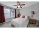 Well-lit bedroom with a cozy bed, window, and stylish decor accents offering comfort and style at 1122 Hartmann Ct, Fort Mill, SC 29715