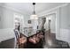 Dining room featuring a glass dining table with seating for six and dark hardwood flooring at 1122 Hartmann Ct, Fort Mill, SC 29715