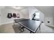 Upstairs bonus room featuring a ping pong table, home exercise equipment, and natural light at 1122 Hartmann Ct, Fort Mill, SC 29715