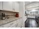 Bright kitchen featuring white cabinetry, granite countertops, and stainless steel appliances at 1122 Hartmann Ct, Fort Mill, SC 29715