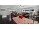 Spacious living room featuring hardwood floors, lots of light, and an open view to the modern kitchen at 1122 Hartmann Ct, Fort Mill, SC 29715