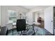 Inviting home office space featuring natural light from two windows and a glass top desk at 1122 Hartmann Ct, Fort Mill, SC 29715