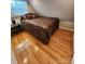 A well lit bedroom with hardwood floors and a comfortable double bed with decorative pillows at 120 Ole Point Ln, Salisbury, NC 28146