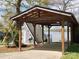 View of home with wooden carport, situated on a waterfront property with scenic views at 120 Ole Point Ln, Salisbury, NC 28146