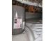 Crawlspace with a water heater and wrapped pipes on a white vinyl floor at 120 Ole Point Ln, Salisbury, NC 28146
