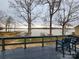 Deck overlooking a lake with chairs, offering a scenic view and relaxation at 120 Ole Point Ln, Salisbury, NC 28146