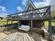 Exterior view of the home with a swing and deck, offering a tranquil and inviting outdoor space at 120 Ole Point Ln, Salisbury, NC 28146