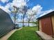 Exterior view of the home and shed, situated on a picturesque lot with waterfront views at 120 Ole Point Ln, Salisbury, NC 28146